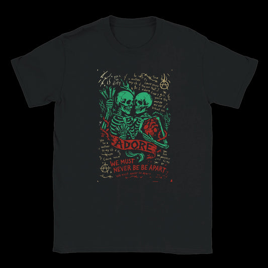 Black T-Shirt with Two skeletons holding each other with a red heart and grunge handwritten text saying "Adore" and "We Must Never Be Apart" on a dark background.