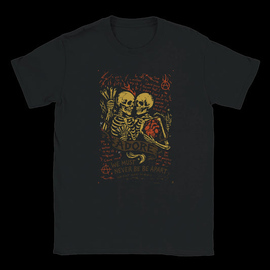 Black Grunge-style T-shirt featuring two skeletons locked in an embrace with a red anatomical heart, surrounded by handwritten punk lyrics and anarchic doodles, with the words "Adore" and "We Must Never Be Apart" on a dark background.