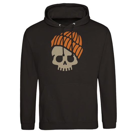 "Colorful skull graphic with a green face, purple eyes, and yellow-striped beanie outlined in gold on a white hoodie—playfully blending streetwear, cartoon, and Día de los Muertos aesthetics."
