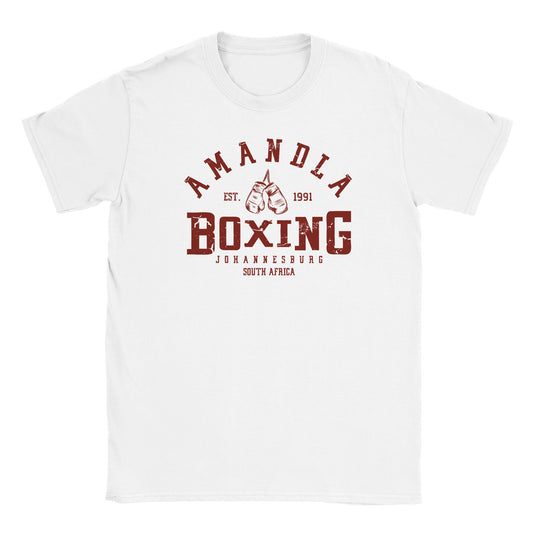 "Maroon-colored vintage boxing design on white shirt with the text 'Amandla Boxing' and 'Johannesburg, South Africa' featuring hanging gloves and established date—symbolizing strength, heritage, and South African pride."

