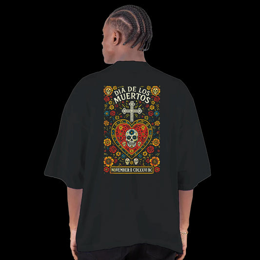 Colorful sugar skull inside ornate red sacred heart with glowing cross above on black t-shirt back