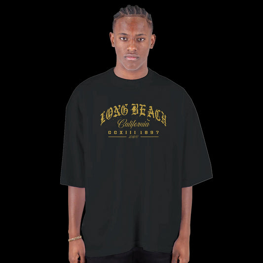 Golden Hour in the LBC Street Script gothic gold lettering design on a black T-shirt
