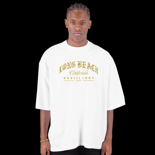 Golden Hour in the LBC Street Script gothic gold lettering design on a white T-shirt