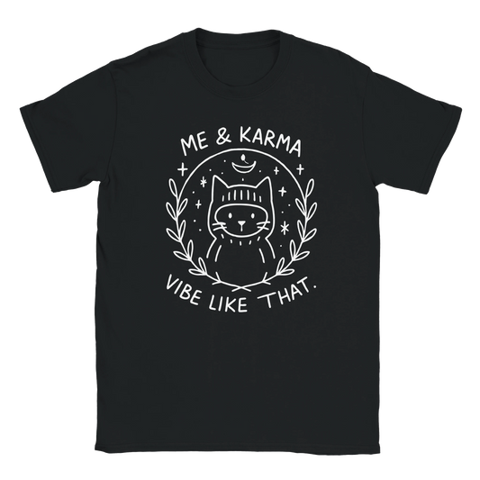 Graphic black T-shirt featuring white line art of a cat with the phrase Me & Karma Vibe Like That, cosmic stars and moon design
