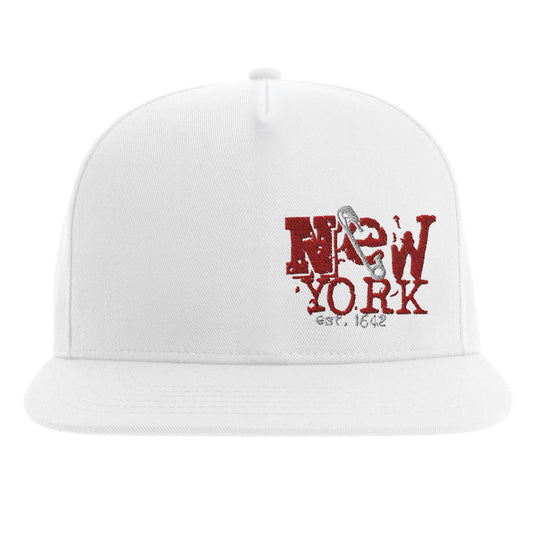 White snapback hat with distressed red NYC embroidery and silver safety pin design